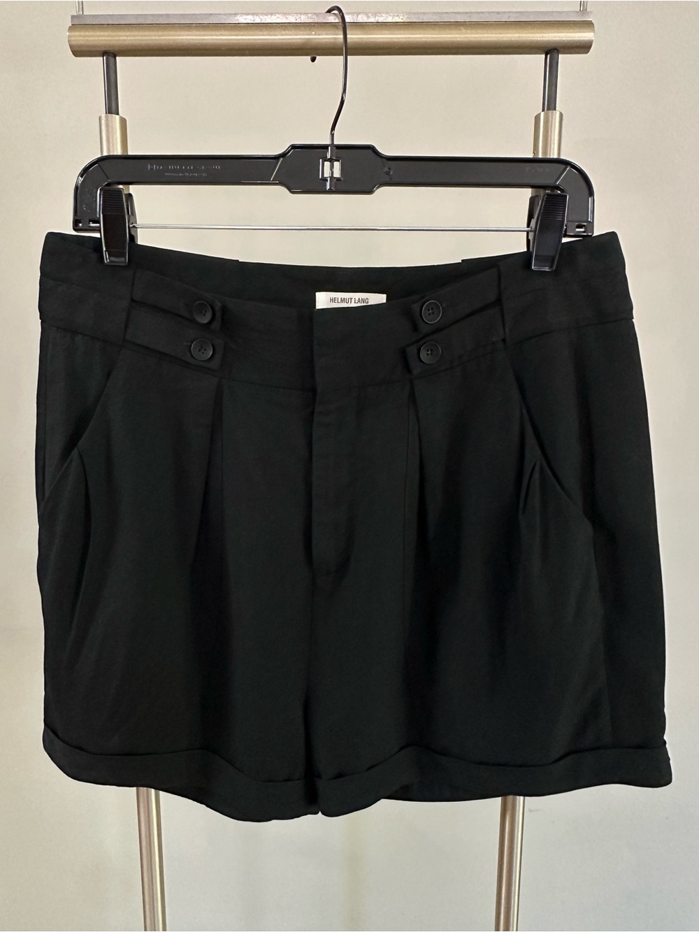 Vintage Helmut Lang pleated trouser shorts in black, button tab detail. Size 6